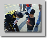 Cole signs autograph for fan